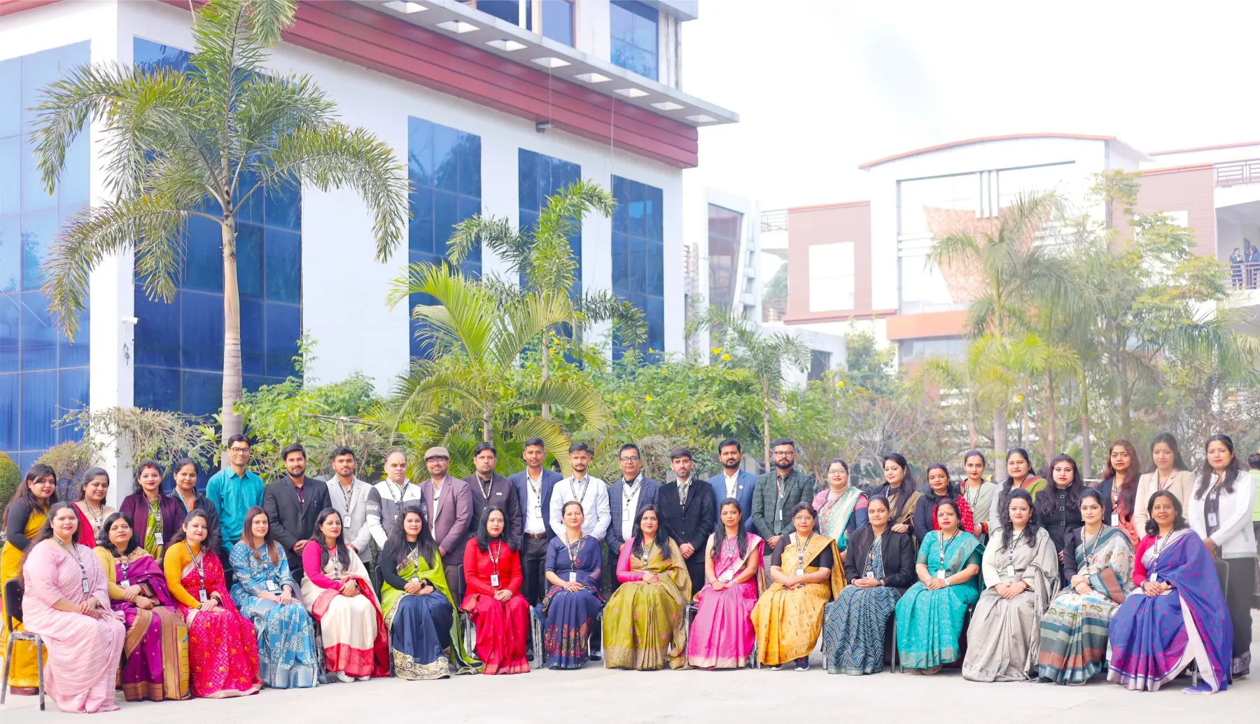 HEC faculty and staff gathered for a group photograph in front of the campus building