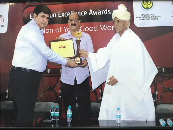 HEC leadership receiving the Best Education Excellence Award 2018