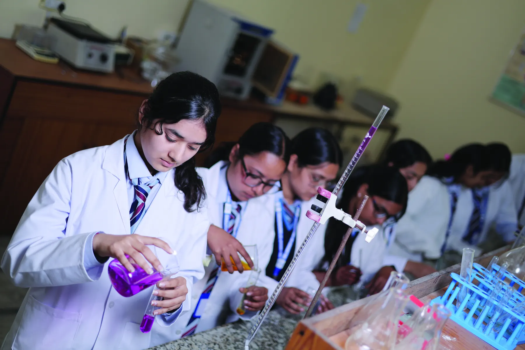Students performing titrations in the chemistry laboratory