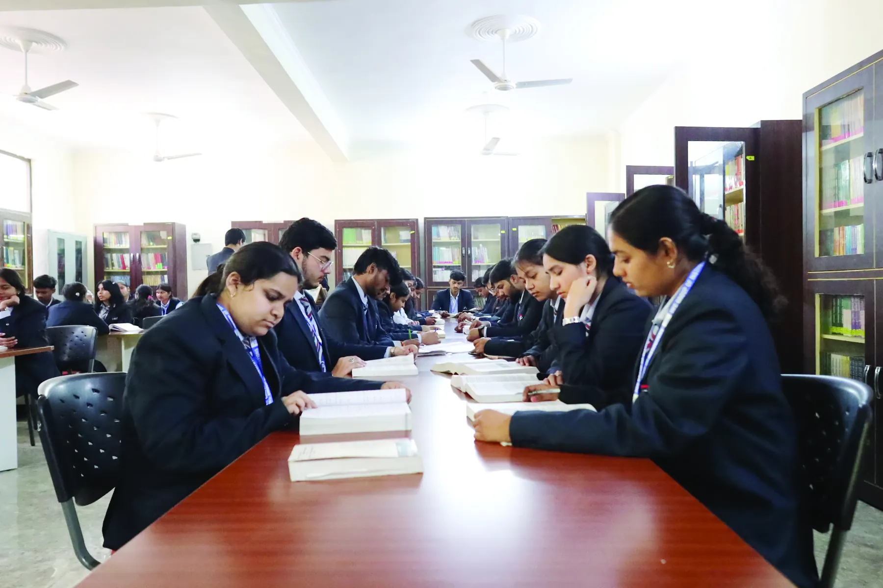 Students studying together in the library reading hall