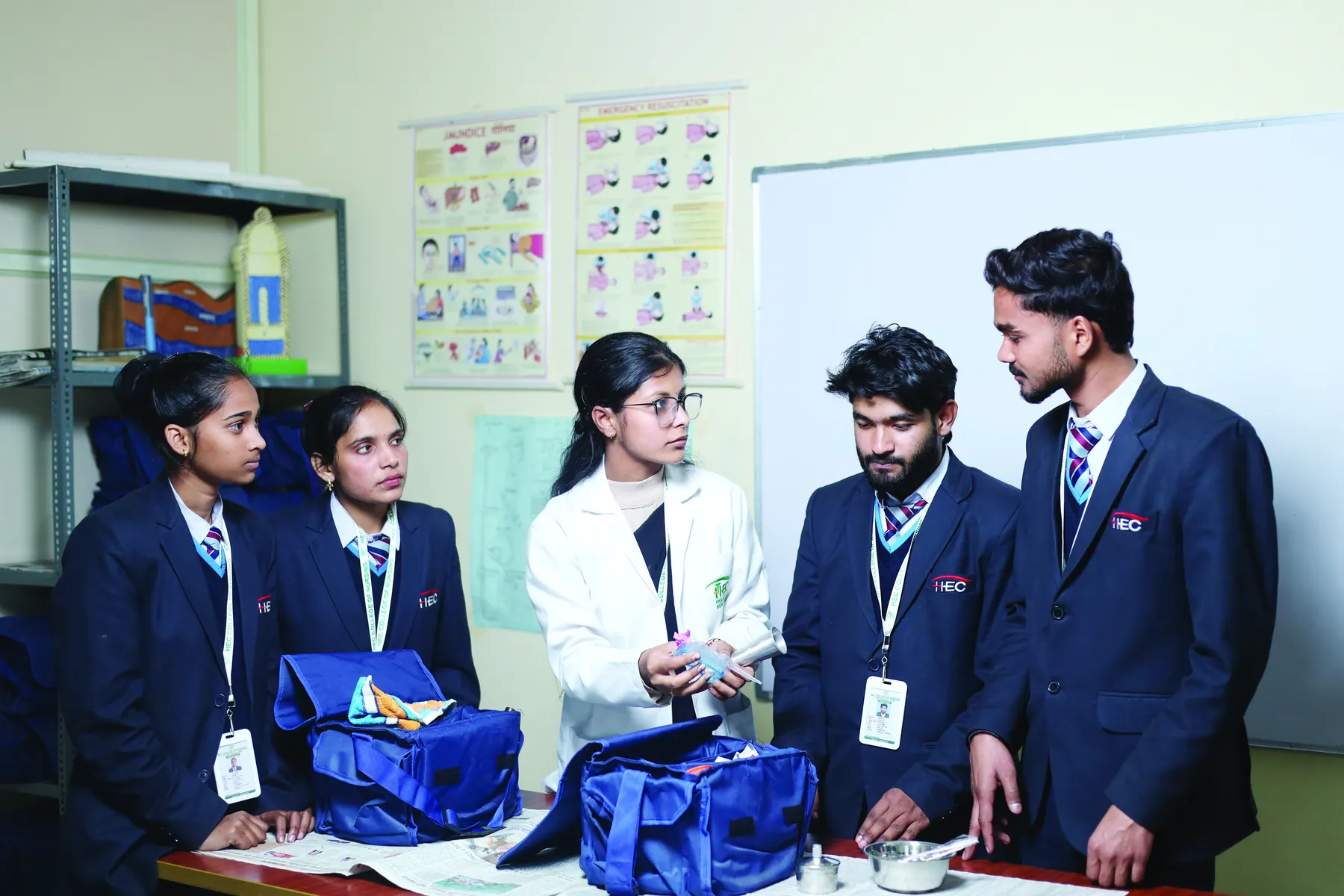 Nursing students practising with a first-aid kit in the skills lab