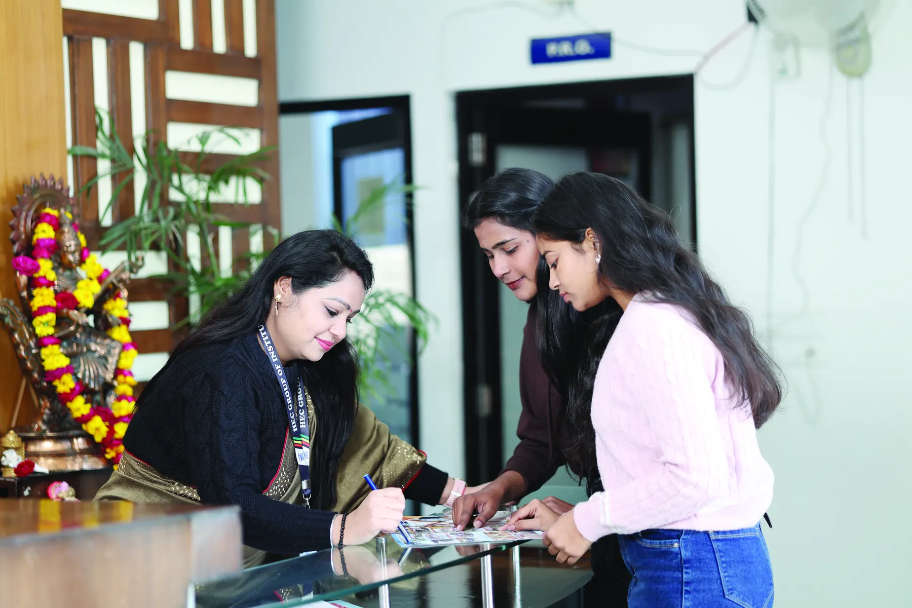 Visitors being helped at the reception desk